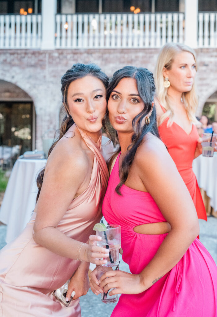 Two women at a wedding cocktail hour