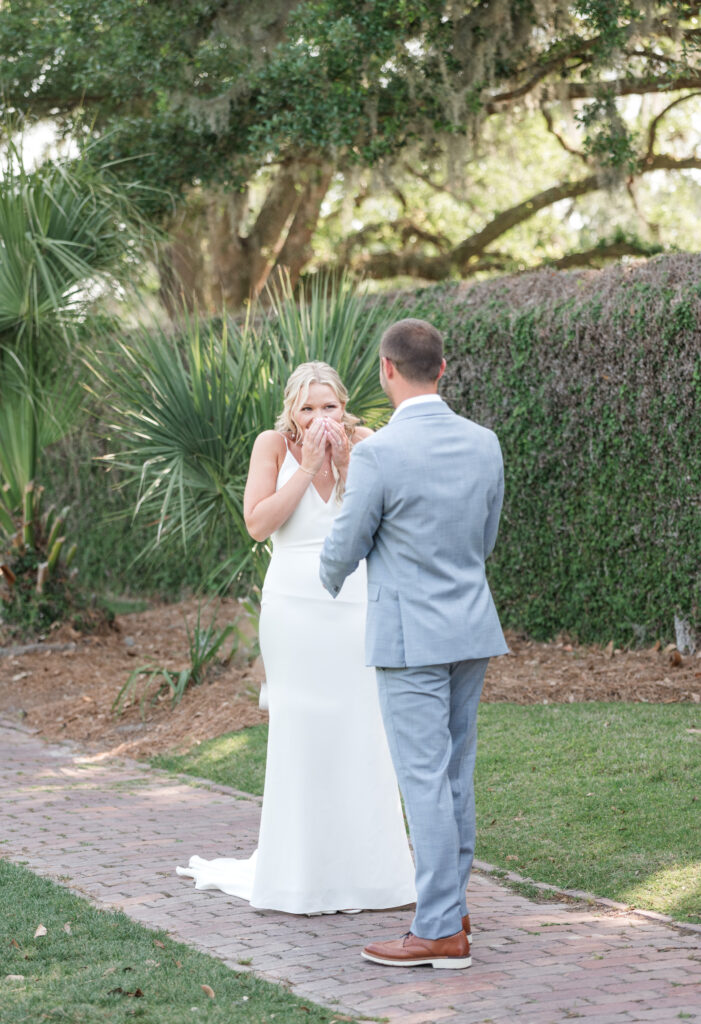 Bride and groom emotional first look at Dunes West in Mount Pleasant, SC.