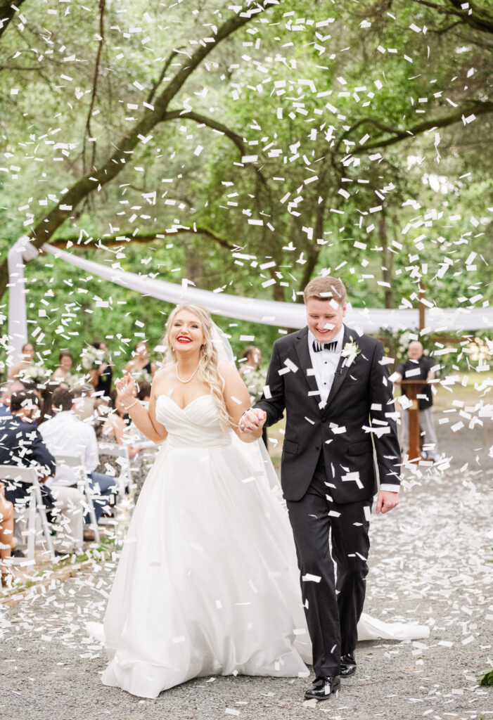 Tanglewood Plantation Wedding Ceremony exit with confetti at midday in South Carolina. 