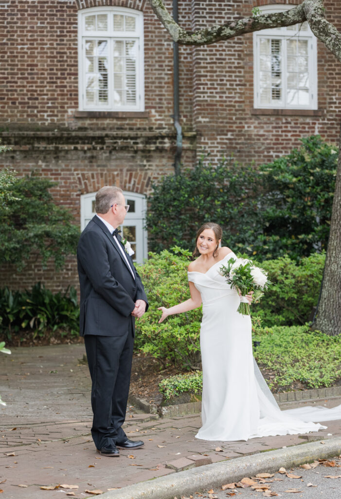 Bride's first look with her father at Historic Rice Mill in Charleston, SC.