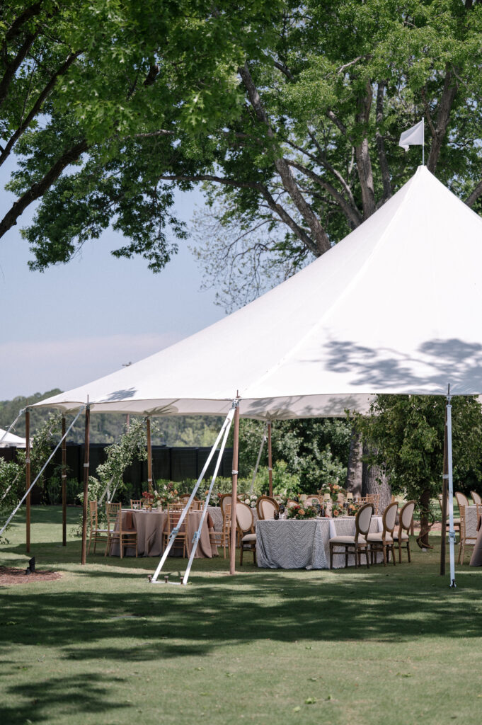 White tent wedding reception space