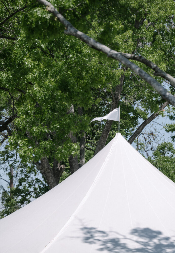 White wedding reception tent with Flag