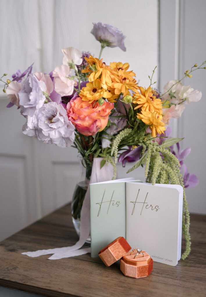 Wedding vow books and bouquet