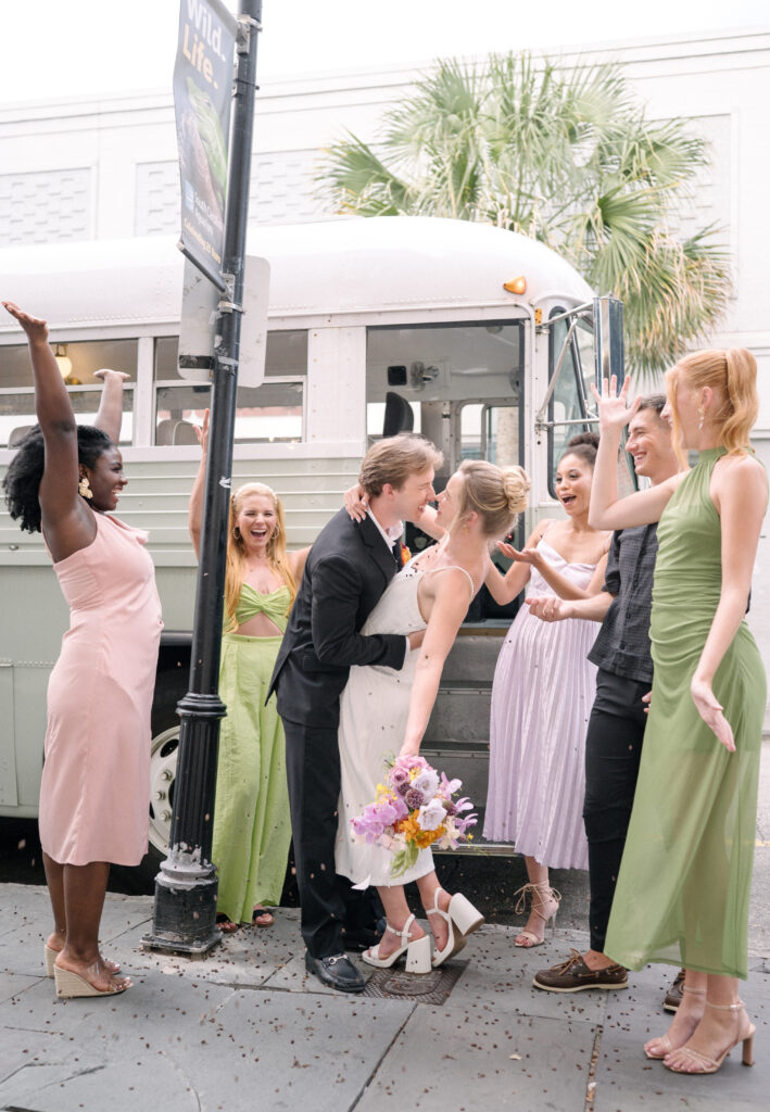 Vintage Lowcountry Valet bus used as wedding prop for celebratory coffee bean toss in Charleston 
